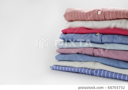 Clean garment neatly folded after laundry over Clean garment neatly folded after laundry over 68703732