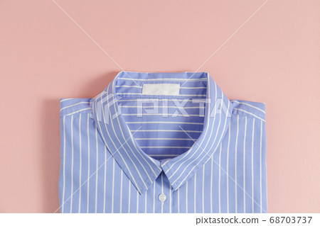 Clean garment neatly folded after laundry over 68703737