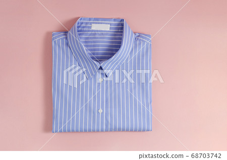 Clean garment neatly folded after laundry over Clean garment neatly folded after laundry over 68703742