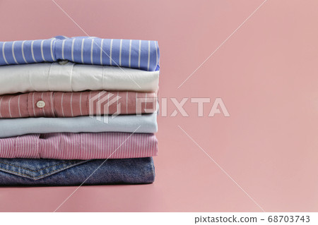 Clean garment neatly folded after laundry over Clean garment neatly folded after laundry over 68703743