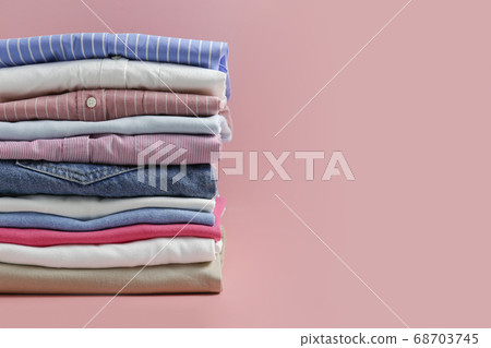Clean garment neatly folded after laundry over Clean garment neatly folded after laundry over 68703745