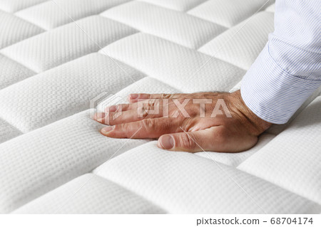 Cropped shot of man testing white orthopedic 68704174