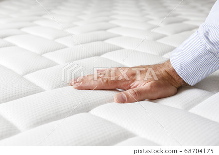 Cropped shot of man testing white orthopedic 68704175