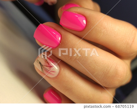 Trendy manicure design on a beautiful background. Trendy manicure design on a beautiful background. 68705119