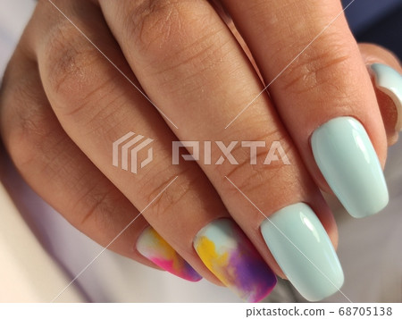 Closeup photo of a beautiful female hands with elegant manicure Closeup photo of a beautiful female hands with elegant manicure 68705138