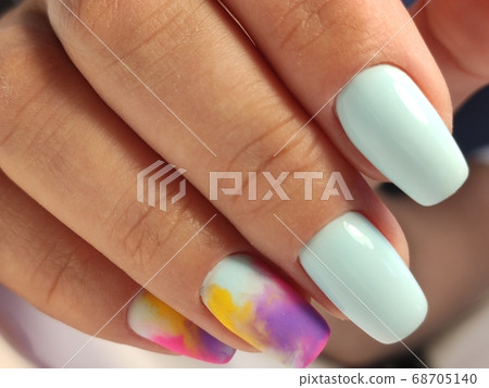 beautiful manicure of nails on the background of a fashionable beautiful manicure of nails on the background of a fashionable 68705140