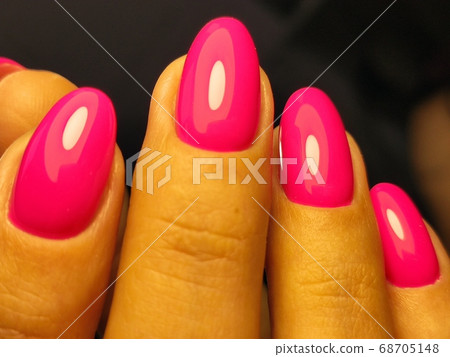 sexy pink manicure on long beautiful nails 68705148