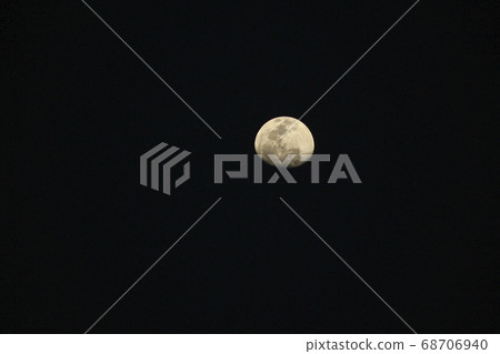 Background moon on a dark sky. 68706940