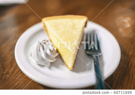 Key lime pie slice at Florida restaurant in the Keys. World famous american traditional dessert homemade, with whipped cream topping on the side. Local food, USA travel Key lime pie slice at Florida restaurant in the Keys. World famous american traditional dessert homemade, with whipped cream topping on the side. Local food, USA travel 68711899