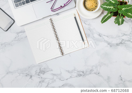 Blank notebook and  Laptop with hot coffee on 68712088