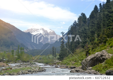 Jhelum River passes through Kashmir Valley bounded by the Great Himalayas and Pir Panjal Range. Jhelum River passes through Kashmir Valley bounded by the Great Himalayas and Pir Panjal Range. 68712632