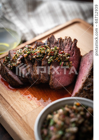 grilled tri tip steak with chimichurri sauce 68712939
