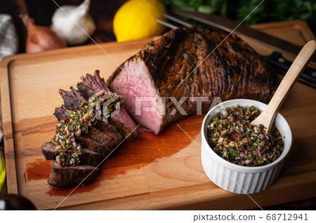 grilled tri tip steak with chimichurri sauce 68712941