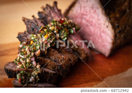 grilled tri tip steak with chimichurri sauce 68712942