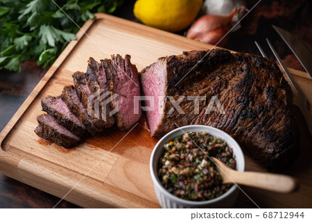 grilled tri tip steak with chimichurri sauce grilled tri tip steak with chimichurri sauce 68712944
