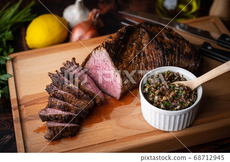 grilled tri tip steak with chimichurri sauce grilled tri tip steak with chimichurri sauce 68712945