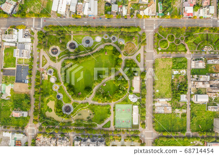 green and funny park at a city 68714454