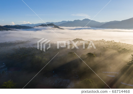 morning cloudy landscape with mist 68714468
