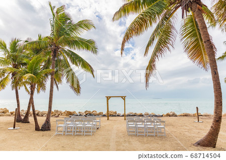 Wedding on beach chairs and altar venue for ceremony background Wedding on beach chairs and altar venue for ceremony background 68714504
