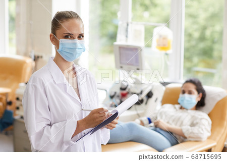 Doctor examining the patient 68715695