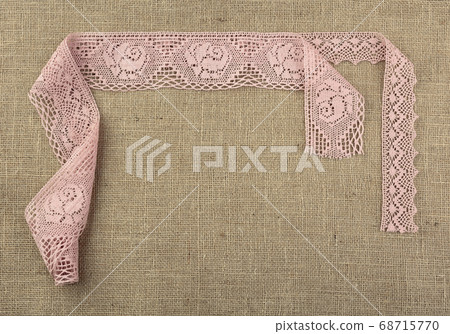 Laces on natural burlap. Laces on natural burlap. 68715770