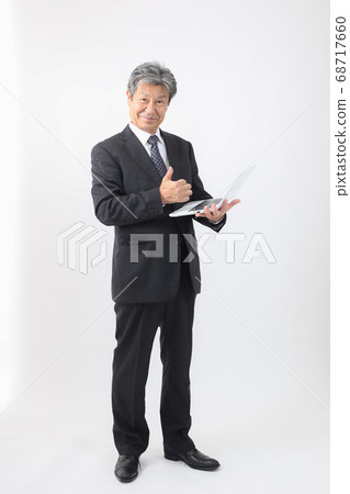Full-body suit with a laptop PC President and CEO Checking sales and other PCs Full-body suit with a laptop PC President and CEO Checking sales and other PCs 68717660