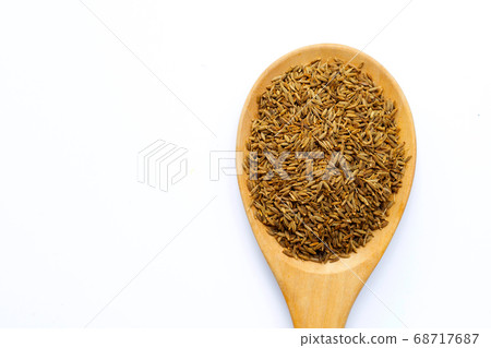 Cumin or caraway seeds on white background. Cumin or caraway seeds on white background. 68717687