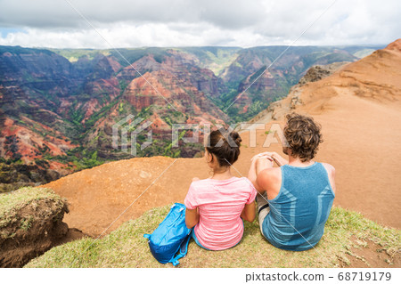 Hawaii Kauai nature hiking couple enjoying view Hawaii Kauai nature hiking couple enjoying view 68719179