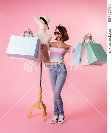 Asian pretty young woman walking over pink  pastel 68722799
