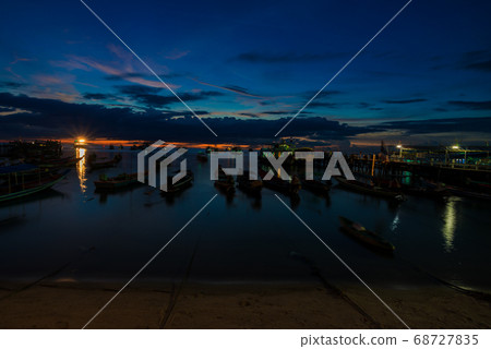 Silhouette boat on bay colorful sky sunset 68727835