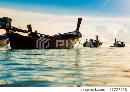 Fisery wooden boat sunrise morning with colorful Fisery wooden boat sunrise morning with colorful 68727958