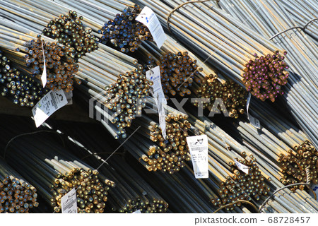 SELANGOR, MALAYSIA -MAY 13, 2016: Hot rolled deformed steel bars or steel reinforcement bar at construction site.It use to strengthen concrete. It is shaped follow the engineer design. SELANGOR, MALAYSIA -MAY 13, 2016: Hot rolled deformed steel bars or steel reinforcement bar at construction site.It use to strengthen concrete. It is shaped follow the engineer design. 68728457