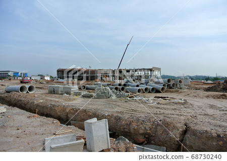 SERDANG, MALAYSIA -JUNE 13, 2016: Construction site in progress at Serdang, Malaysia during the daytime. Workers busy with their task installing formwork and reinforcement bar.      68730240
