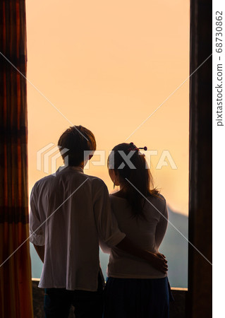 Asian man hugging the waist a asian woman enjoying Asian man hugging the waist a asian woman enjoying 68730862