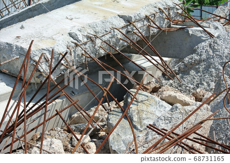 MALACCA, MALAYSIA -JUNE 14, 2016: The ruins of concrete walls and exposed steel reinforcements inside. 68731165