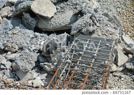 MALACCA, MALAYSIA -JUNE 14, 2016: The ruins of concrete walls and exposed steel reinforcements inside. MALACCA, MALAYSIA -JUNE 14, 2016: The ruins of concrete walls and exposed steel reinforcements inside. 68731167