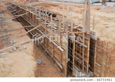 SEREMBAN, MALAYSIA -MAY 30, 2020: Concrete drain under construction at the construction site. It is built inside the earth trenches and the invert level has been determined by surveyor earlier. 68733461