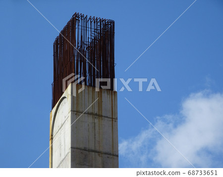 SEREMBAN, MALAYSIA -MARCH 7, 2020: Steel reinforced concrete column under construction. Reinforcement bar on top of column ready for the next stage of construction. 68733651