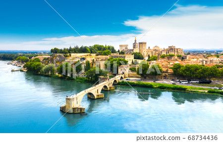 Saint Benezet bridge in Avignon in a beautiful summer day, France Saint Benezet bridge in Avignon in a beautiful summer day, France 68734436