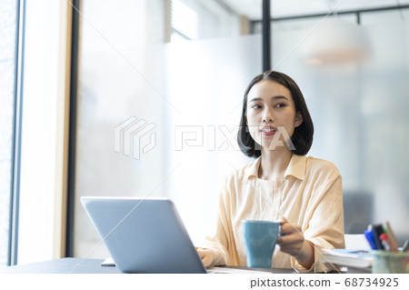 A woman who plays desk work A woman who plays desk work 68734925