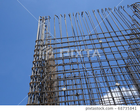 KUALA LUMPUR, MALAYSIA -AUGUST 05, 2017: Steel reinforcement bar used to reinforced concrete at the construction site. It was tied together using tiny wires by construction workers.  68735841
