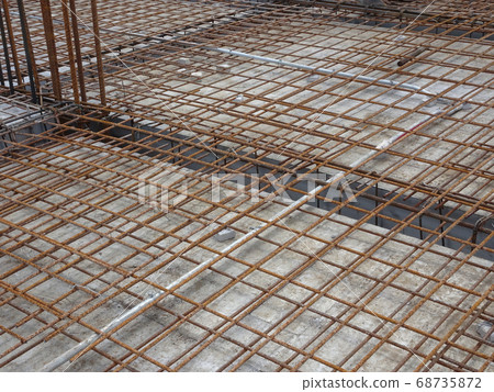 SELANGOR, MALAYSIA -JANUARY 18, 2017: Slab steel reinforcement bar laid on top of timber form work to form part of the floor slab structure after poured with concrete.  68735872