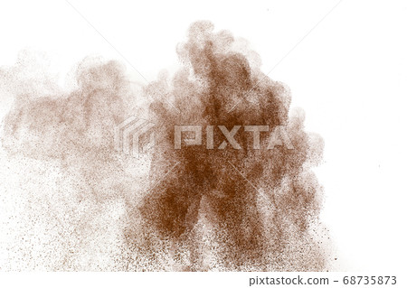 Brown dust exploding cloud.Brown particles splattered on white background. 68735873