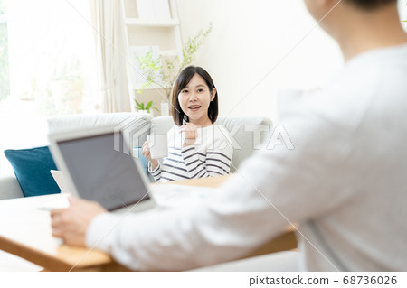 Middle couple doing telework [Living] 68736026