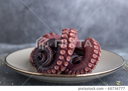 Delicious octopus tentacles served on a fine plate 68736777