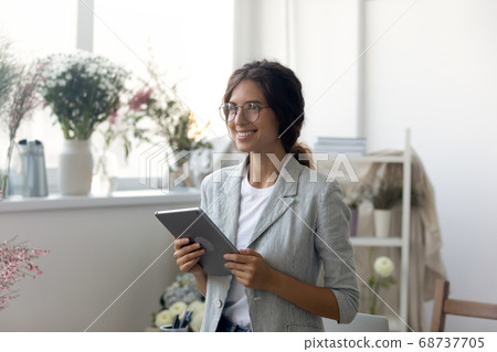 Happy young dreamy woman thinking of future challenges. 68737705