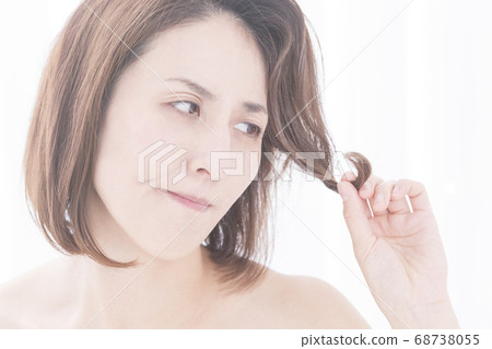 Woman suffering from hair Woman suffering from hair 68738055