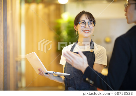 A clerk checking inventory A clerk checking inventory 68738528