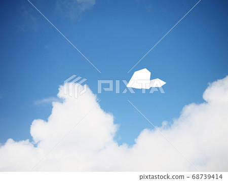 Paper airplane flying in the sky 68739414