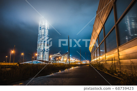 Russia, St. Petersburg, July -2020:night view of the city of St. Petersburg, view of the skyscraper business center of Gazprom, Lakhta center. the tallest building in Europe.Reflection in noise shield 68739423